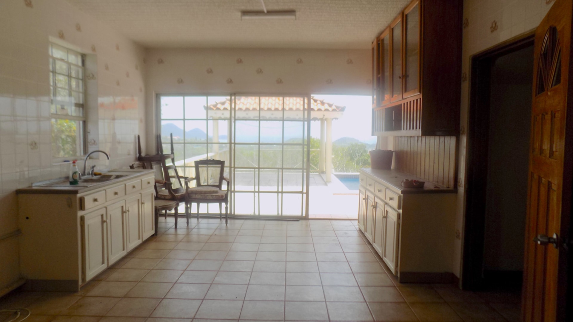 fixer upper home for sale with ocean view glass doors