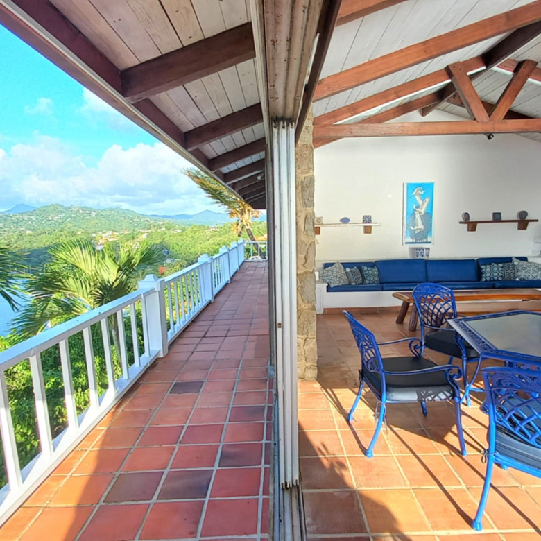 St Lucia Real Estate The Cliff House Overlooking Marigot Bay blue table