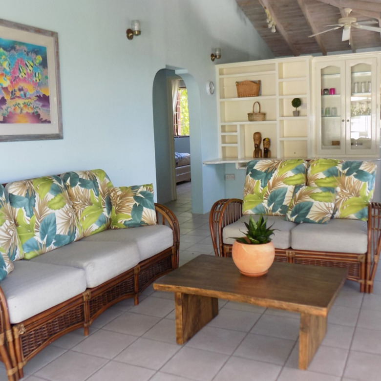 st lucia real estate 2 bedroom Cozzy Cottage For Rent at Cap Estate, St. Lucia rattan chairs