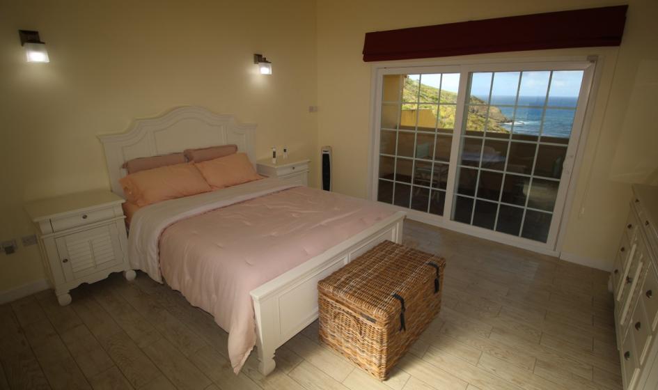 st lucia real estate Surfside Villas At Anse Galet Bay pink bed