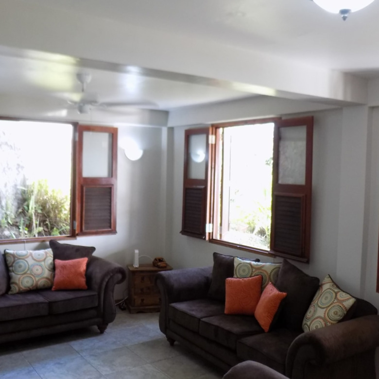 St Lucia real estate : HARBOUR VIEW VILLA FOR RENT brown sofas
