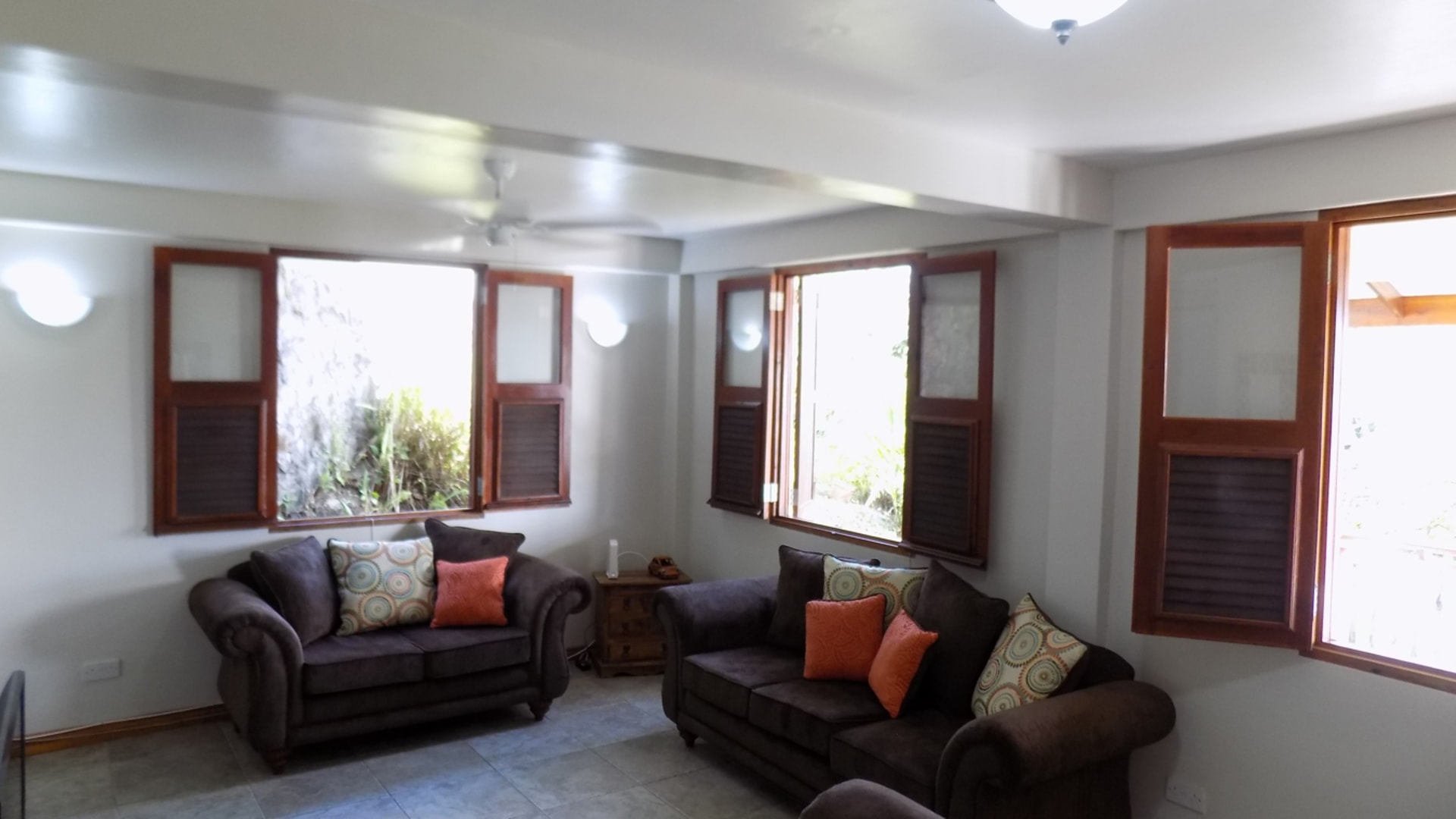 St Lucia real estate : HARBOUR VIEW VILLA FOR RENT brown sofas
