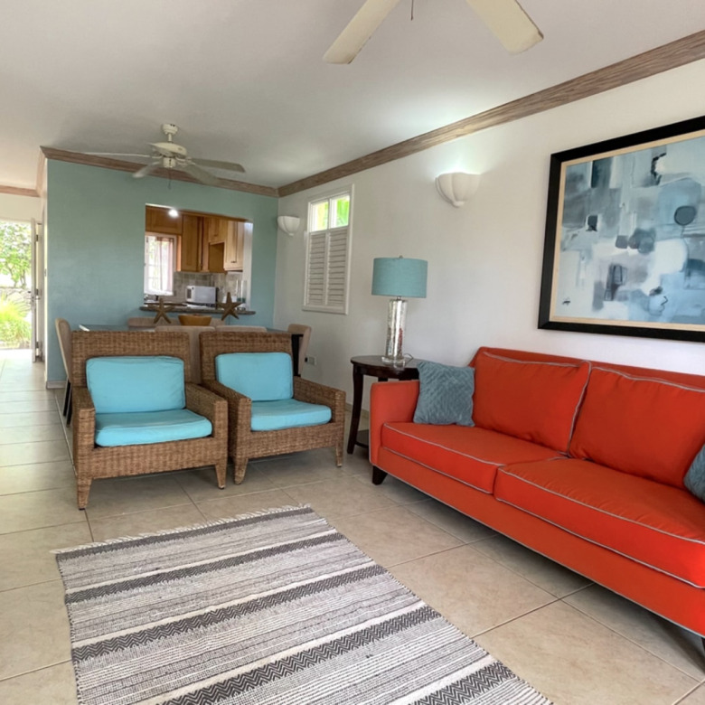 St Lucia real estate VILLAS ON THE GREEN 2 For Rent red chair