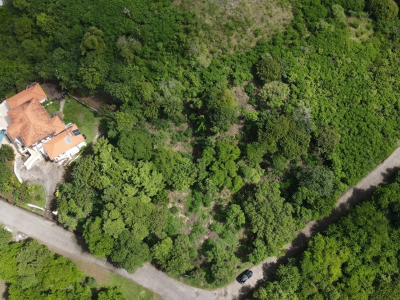 Own a lot with stunning golf course views in Mount Hardy, St. Lucia. Perfect for your dream home or luxury investment property.